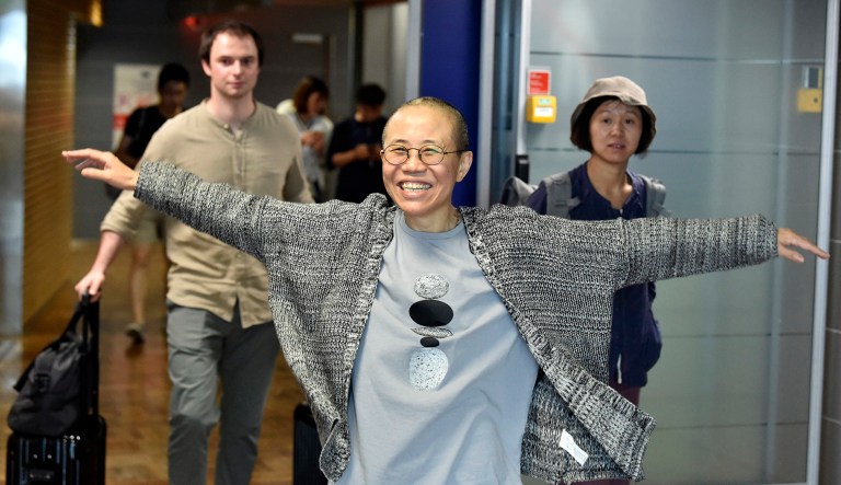 Liu Xia, the widow of Chinese Nobel dissident Liu Xiaobo, gestures she arrives at the Helsinki International Airport in Vantaa, Finland, Tuesday, July 10, 2018. China on Tuesday allowed Liu Xia to fly to Berlin, ending an eight-year house arrest that had drawn intense international criticism and turned the 57-year old poet _ who reluctantly followed her husband into politics two decades ago _ into a tragic icon known around the world.