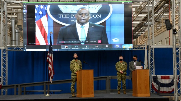 Naval Information Warfare Systems Commandâs leadership triad listen to a video message from Secretary of Defense Lloyd J. Austin III during a DoD-mandated extremism stand down.