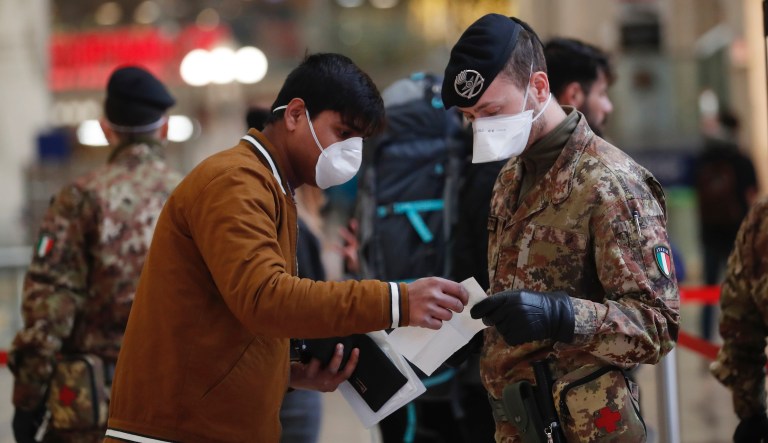 Police officers and soldiers check passengers leaving from Milan main train station, Italy, Monday, March 9, 2020. Italy took a page from Chinaâs playbook Sunday, attempting to lock down 16 million people â more than a quarter of its population â for nearly a month to halt the relentless march of the new coronavirus across Europe. Italian Premier Giuseppe Conte signed a quarantine decree early Sunday for the countryâs prosperous north. Areas under lockdown include Milan, Italyâs financial hub and the main city in Lombardy, and Venice, the main city in the neighboring Veneto region.