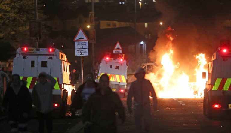 A burning car in Creggan, Londonderry, after petrol bombs were thrown at police.