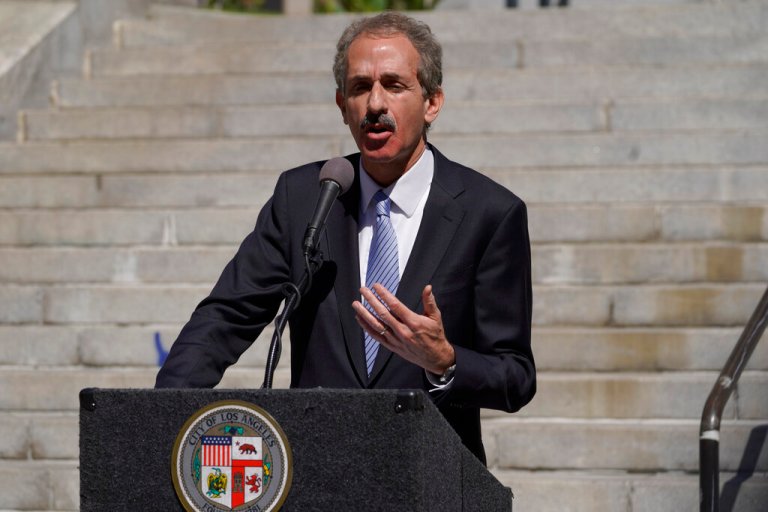 FILE - Los Angeles City Attorney Mike Feuer speaks at a news conference outside Los Angeles City Hall, March 7, 2022.