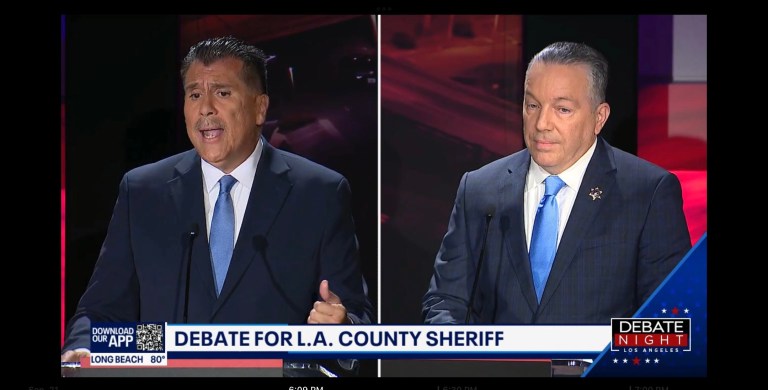 Los Angeles County sheriff candidates Robert Luna, left, and incumbent Alex Villanueva, right, hold a televised debate on Sept. 21, 2022.