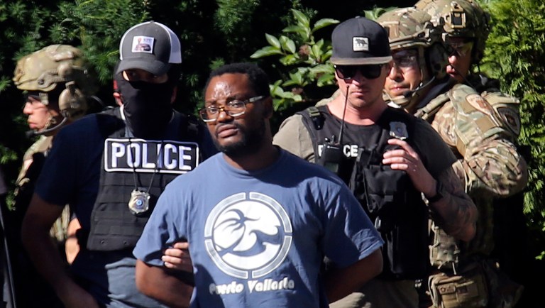 Salt Lake City police take a man into custody in connection with missing University of Utah student MacKenzie Lueck in Salt Lake City on Friday, June 28, 2019.  Salt Lake City police said the man was brought in Friday morning, but did not immediately provide further details.  Lueck disappeared after taking a Lyft June 17 from the airport to a park.