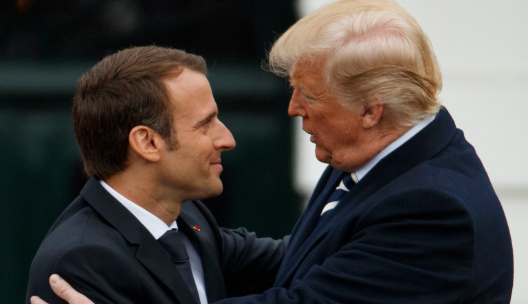 President Donald Trump hugs French President Emmanuel Macron during a State Arrival Ceremony on the South Lawn of the White House, Tuesday, April 24, 2018, in Washington.
