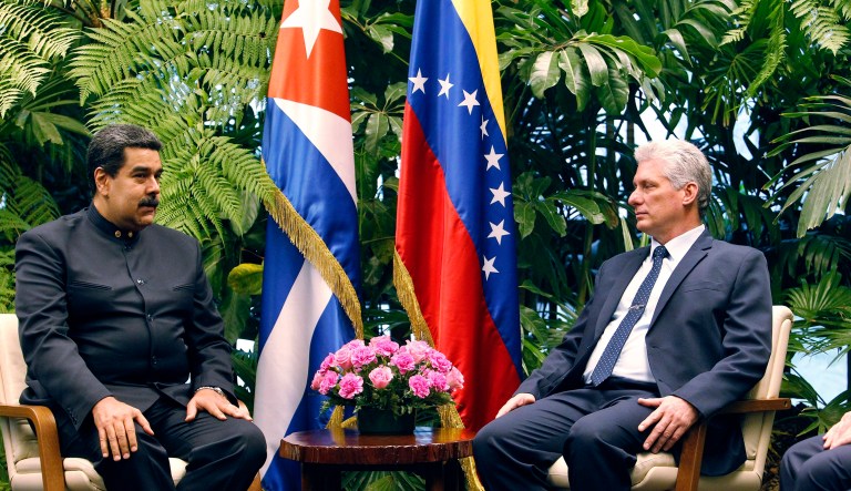 Cuba's President Miguel Diaz-Canel, right, listens as Venezuela's President Nicolas Maduro speaks during a photo opportunity at Revolution Palace in Havana, Cuba, Saturday, April 21, 2018. Maduro is in Cuba for a two-day visit.