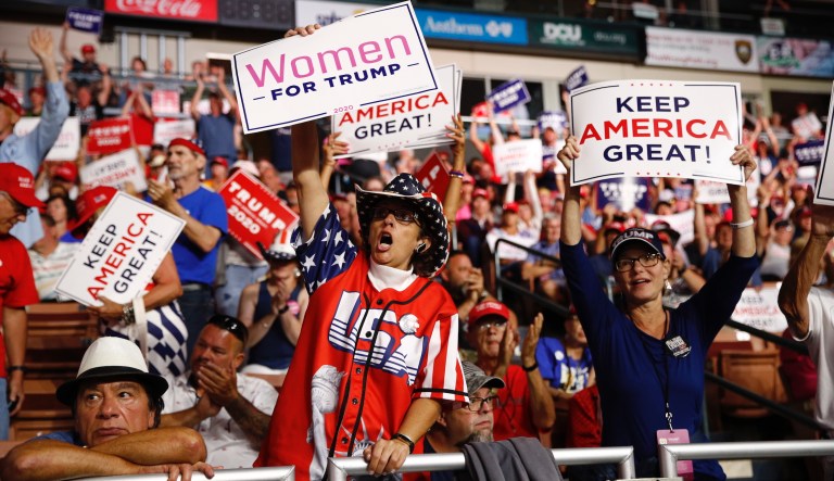 Supporters rally as President Donald Trump speaks at a campaign rally, Thursday, Aug. 15, 2019, in Manchester, N.H. 