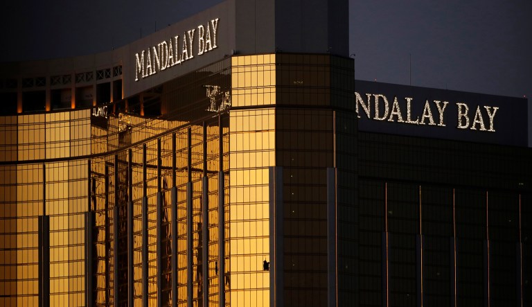FILE - In this Oct. 3, 2017, file photo, windows are broken at the Mandalay Bay resort and casino in Las Vegas, the room from where Stephen Craig Paddock fired on a nearby music festival, killed 58 and injuring hundreds on Oct. 1, 2017. Attorneys in a negligence lawsuit stemming from the Las Vegas Strip shooting say the massacre could have been avoided if a hotel tightened security after a man was found with multiple weapons at the Mandalay Bay resort in 2014. Lawyer Robert Eglet said Friday, July 6, 2018, that the arrest of Kye Aaron Dunbar in a 24th-floor hotel room with guns including an assault-style rifle, tripod and a telescopic sight bears similarities to the Oct. 1 shooting.