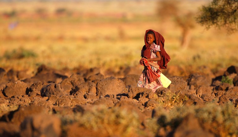 A Masai child walks near a village in the Amboseli national park, Kenya, March 21 2007.