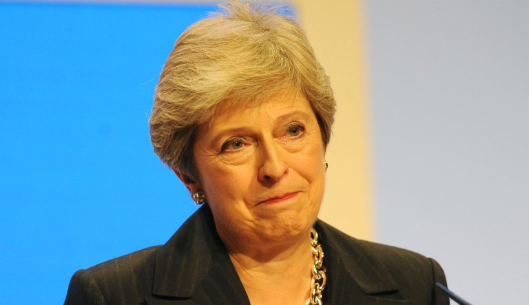 Conservative Party Leader and Prime Minister Theresa May addresses delegates during a speech at the Conservative Party Conference at the ICC, in Birmingham, England, Wednesday, Oct. 3 , 2018.
