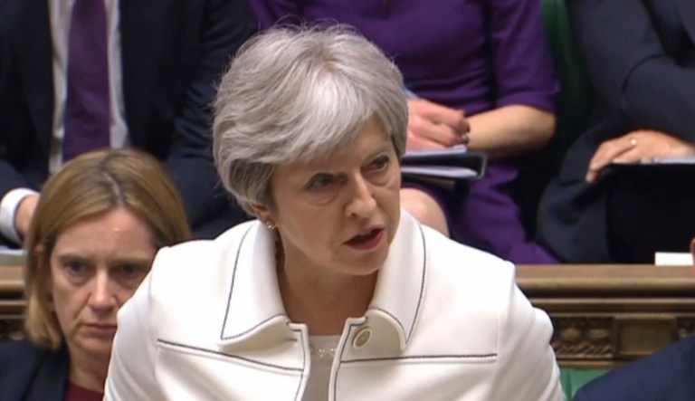 Britain's Prime Minister Theresa May makes a statement to MPs in the House of Commons in London, Monday April 16, 2018 over her decision to launch air strikes against Syria. British Prime Minister Theresa May told restive lawmakers on Monday that military airstrikes against Syria were right both legally and morally, and accused Syria and its ally Russia of attempting to cover-up evidence of a deadly chemical weapons attack.