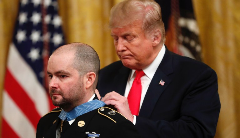President Donald Trump awards the Medal of Honor to Ronald J. Shurer II, during a ceremony in the East Room of the White House in Washington, Monday, Oct. 1, 2018. 