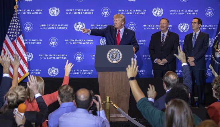 U.S. President Donald Trump takes a question while Mike Pompeo, U.S. secretary of state, center, and Steven Mnuchin, U.S. Treasury secretary, right, listen during a news conference in New York, U.S., on Wednesday, Sept. 25, 2019.