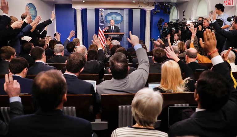 FILE - In this Feb. 22, 2017, file photo, reporters raise their hands as White House press secretary Sean Spicer takes questions during the daily briefing in the Brady Press Briefing Room of the White House in Washington. A survey finds that thereâs a big change in just a year in how Democrats and Republicans view the mediaâs role as watchdogs of political leaders. A Pew Research Center study out Wednesday, May 10, said nearly nine in 10 Democrats said a critical media is important because it keeps political leaders from doing things they shouldnât. Meanwhile, only 42 percent of Republicans feel that way.