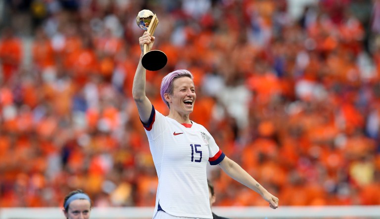 United States' Megan Rapinoe celebrates her team's victory with the trophy after the Women's World Cup final soccer match between US and The Netherlands at the Stade de Lyon in Decines, outside Lyon, France, Sunday, July 7, 2019.