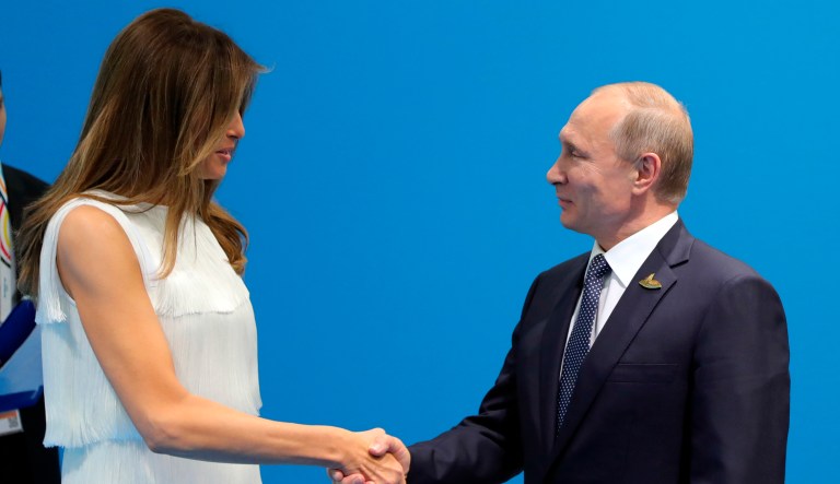 Russian President Vladimir Putin greets U.S. President Donald Trump's wife Melania, prior his talks with U.S. President Donald Trump during the G20 summit in Hamburg Germany, Friday July 7, 2017.
