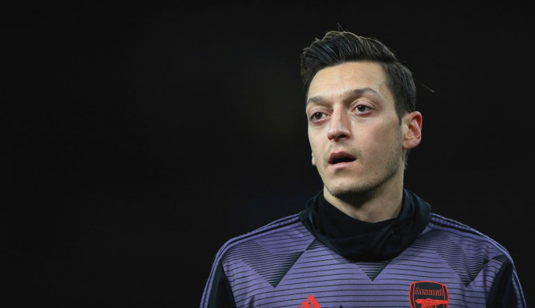 Arsenal's Mesut Ozil warms up prior the English Premier League soccer match between Arsenal and Manchester City, at the Emirates Stadium in London, Sunday, Dec. 15, 2019.