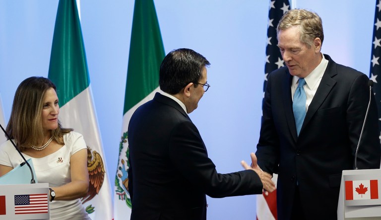 Canada's Foreign Minister Chrystia Freeland looks on as Mexico's Economy Secretary Ildefonso Guajardo Villarreal and U.S. Trade Representative Robert Lighthizer shake hands after the second round of NAFTA renegotiations in Mexico City on Sept. 5, 2017.