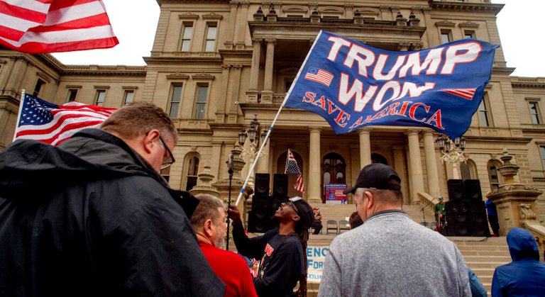 Michigan lawmaker spotted wearing ‘Q’ pin at Trump-endorsed election rally at state capitol