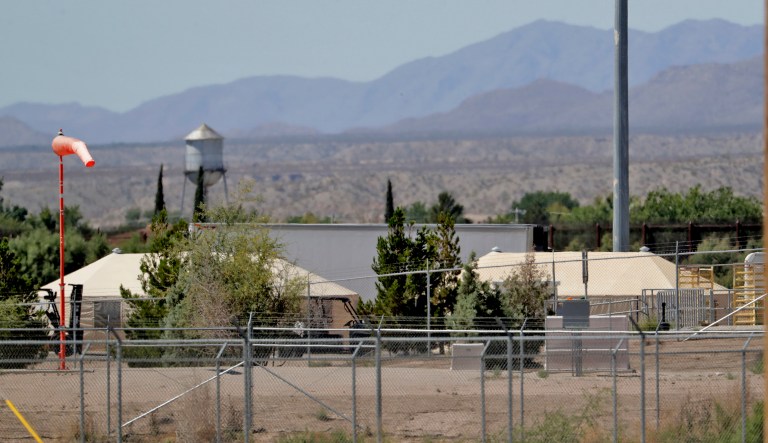 Mexico backdrops tent shelters used to hold separated migrant family members along the International border, Friday, June 22, in Fabens, Texas. The U.N human rights office says President Donald Trump's decision to stop the U.S. policy separating migrant parents from their children doesn't go far enough.