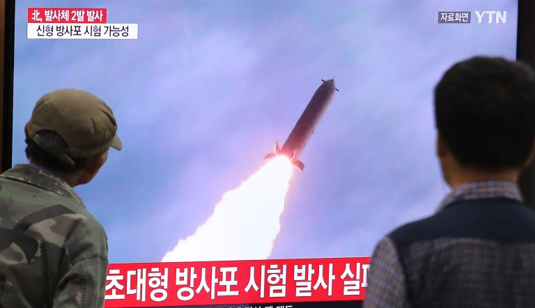 People watch a TV showing a file image of an unspecified North Korea's missile launch during a news program at the Seoul Railway Station in Seoul, South Korea, Thursday, Oct. 31, 2019. South Korea's military said North Korea on Thursday fired two projectiles toward its eastern sea, an apparent resumption of weapons tests aimed at ramping up pressure on Washington over a stalemate in nuclear negotiations. The sign reads: "North Korea fired two projectiles."