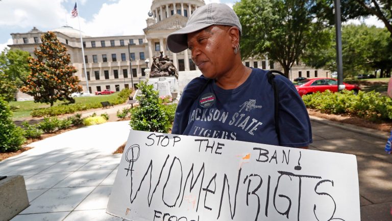An abortion rights advocate holds signage at the Capitol in Jackson, Miss., voicing her opposition to state legislatures passing abortion bans that prohibit most abortions once a fetal heartbeat can be detected, Tuesday, May 21, 2019. In addition, there are no provisions for rape or incest. Mississippi is among the states that have passed and signed into law such legislation. 