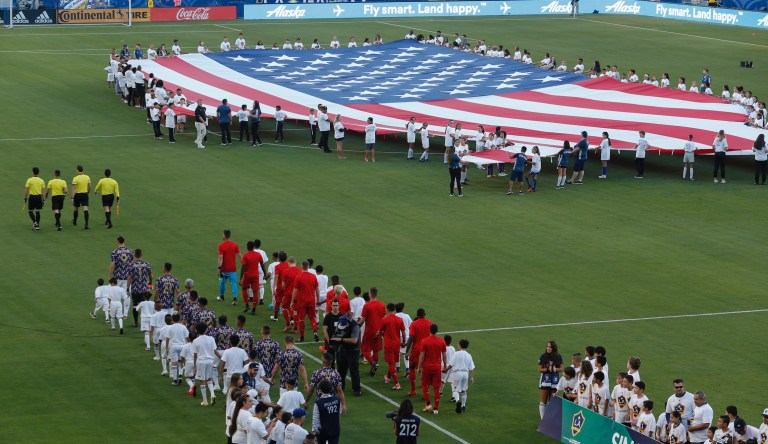 A giant US flag is displayed during the National Anthem prior to the Toronto FC and LA Galaxy soccer game, Thursday, July 4, 2019, in Carson, Calif. 