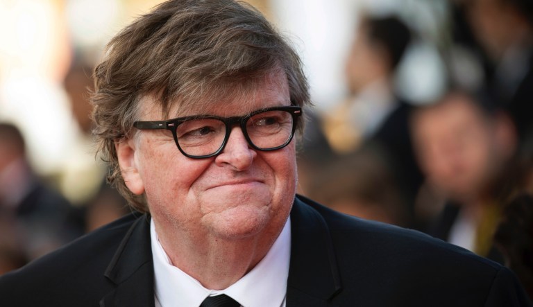 Michael Moore poses for photographers upon arrival at the awards ceremony of the 72nd international film festival, Cannes, southern France, Saturday, May 25, 2019.