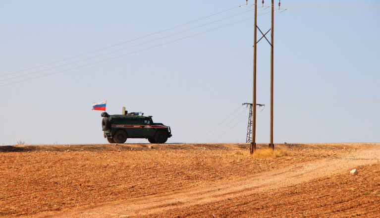 Russian forces armored vehicles patrol the Syrian border in Kobani, Wednesday, Oct. 23, 2019. Russian military police began patrols on part of the Syrian border Wednesday, quickly moving to implement an accord with Turkey that divvies up control of northeastern Syria. (AP Photo)
