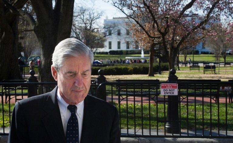 Special counsel Robert Mueller walks past the White House after attending services at St. John's Episcopal Church. (AP Photo/Cliff Owen)