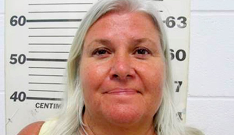 This photo provided by the South Padre Island Police Department shows Lois Riess, of Blooming Prairie, Minn., who was arrested by federal deputy marshals Thursday, April 19, 2018, at a restaurant in South Padre Island, Texas. Investigators believe she killed her husband in Minnesota then fled to Florida where she used the same gun to slay her doppelganger with the intention of assuming her identity. Riess had been on the run since at least late March.