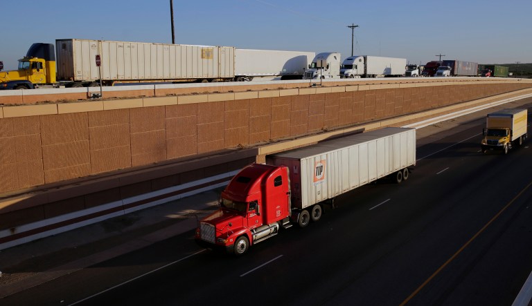 In this Monday, Nov. 21, 2016 photo, trucks move along Interstate 35, in Laredo, Texas. Donald Trumpâs campaign promise to abandon the North American Free Trade Agreement helped win over Rust Belt voters who felt left behind by globalization. But the idea is unnerving to many people in cities on the U.S.-Mexico border.