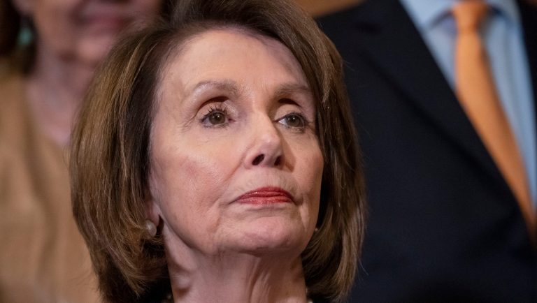 House Speaker Nancy Pelosi, D-Calif., stands at a Democratic event ahead of a House floor vote on the Health Care and Prescription Drug Package, at the Capitol in Washington, Wednesday, May 15, 2019. Earlier, at the National Peace Officers Memorial Day service, Attorney General William Barr asked Pelosi, "Madam Speaker, did you bring your handcuffs?" a reference to Barr's refusal to comply with congressional subpoenas related to special counsel Robert Mueller's report. 