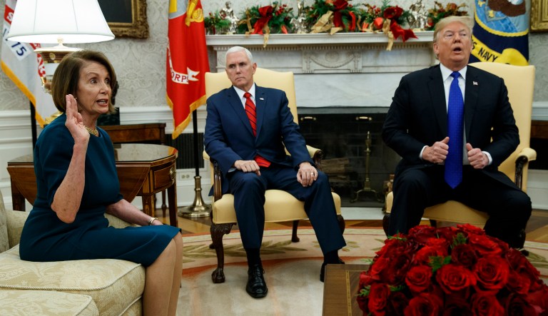 Vice President Mike Pence, center, looks on as House Minority Leader Rep. Nancy Pelosi, D-Calif., speaks during a meeting with President Donald Trump in the Oval Office of the White House, Tuesday, Dec. 11, 2018, in Washington.