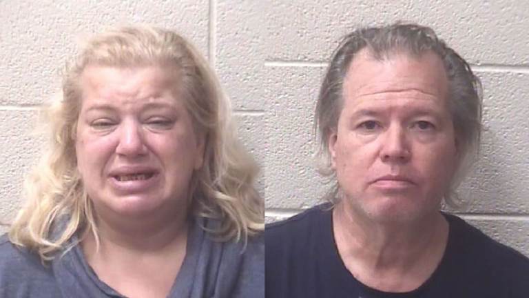 Robin Lynn Byrum, left, and her husband, Scott Gordon Poole, right after being arrested for the death of a newborn in South Nags Head.