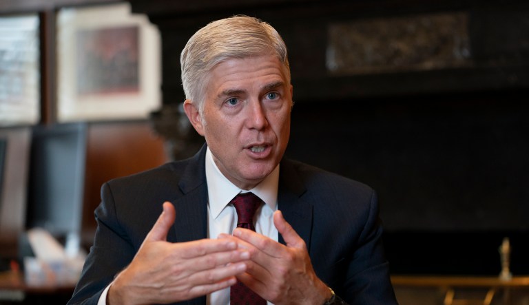 Associate Justice Neil Gorsuch, President Donald Trump's first appointee to the high court, speaks to The Associated Press about events that have influenced his life and the loss of civility in public discourse, in his chambers at the Supreme Court in Washington, Wednesday, Sept. 4, 2019.