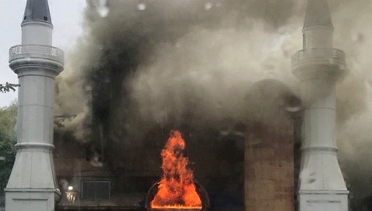 In this photo provided by Lina Biroscak, a fire burns at a mosque, Sunday, May 12, 2019, in New Haven, Conn. It was not immediately clear what caused the fire. 