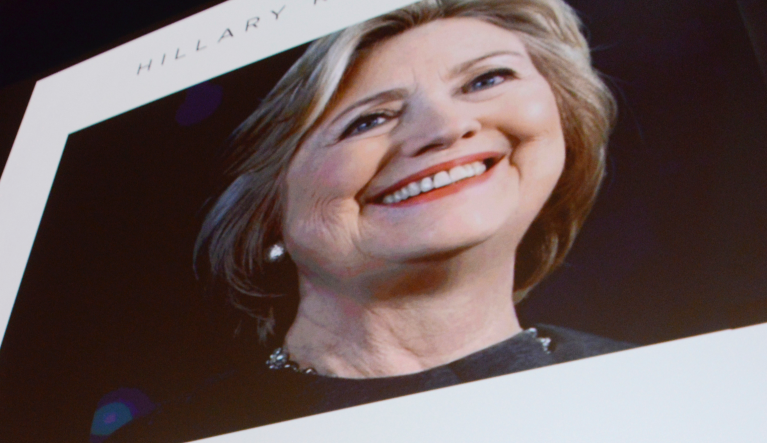 Former Secretary of State Hillary Clinton answers questions posed by student journalists Charlotte Geier, a Maine South senior, middle, and Dalal Hassane, a Maine East sophomore, during the Trailblazing Women of Park Ridge event in Park Ridge, Ill., Friday, Oct. 11, 2019. (Joe Lewnard/Daily Herald via AP)