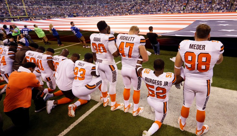 Members of the Cleveland Browns take a knee during the national anthem before an NFL football game against the Indianapolis Colts in Indianapolis, Sunday, Sept. 24, 2017.