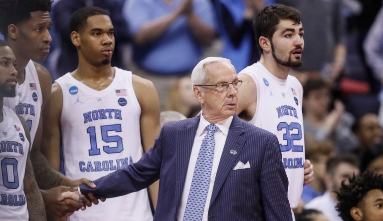 North Carolina coach Roy Williams congratulates his players in the final moments of the second half during a second-round men's college basketball game against Washington in the NCAA Tournament, Sunday, March 24, 2019, in Columbus, Ohio.