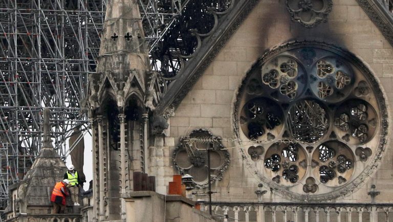 Experts inspect the damaged Notre Dame cathedral after the fire in Paris, Tuesday, April 16, 2019. Experts are assessing the blackened shell of Paris' iconic Notre Dame cathedral to establish next steps to save what remains after a devastating fire destroyed much of the almost 900-year-old building. With the fire that broke out Monday evening and quickly consumed the cathedral now under control, attention is turning to ensuring the structural integrity of the remaining building. 