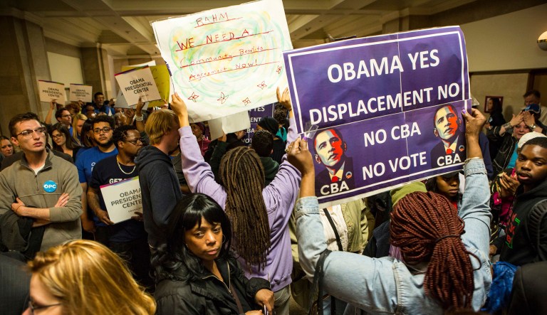 Crowds protest outside a planning commission meeting for the Obama Presidential Center at City Hall demanding a Community Benefit Agreement, Thursday, May 17, 2018, in Chicago.