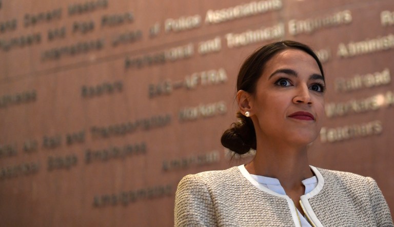 Rep.-elect Alexandria Ocasio-Cortez, D-N.Y., listens during a news conference with members of the Progressive Caucus in Washington, Monday, Nov. 12, 2018.
