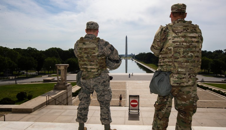 FILE - In this June 3, 2020 file photo members of the District of Columbia Army National Guard stand guard at the Lincoln Memorial in Washington securing the area as protests continue following the death of George Floyd, a who died after being restrained by Minneapolis police officers. An Ohio National Guardsman was removed from policing protests in Washington D.C. after the FBI found he expressed white supremacist ideology online, Gov. Mike DeWine announced in a briefing Friday, June 5, 2020. 