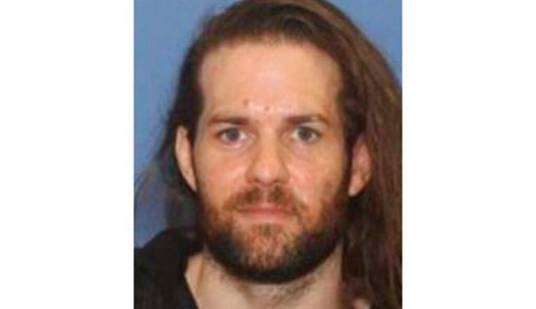 This undated photo provided by the Grants Pass Police Department shows Benjamin Obadiah Foster. Foster, accused of torturing a woman he held captive in Oregon, and who was convicted in Nevada of keeping another woman in captivity, is using dating apps to find people who can help him avoid the police or to find new victims, authorities said Friday, Jan. 27, 2023.`