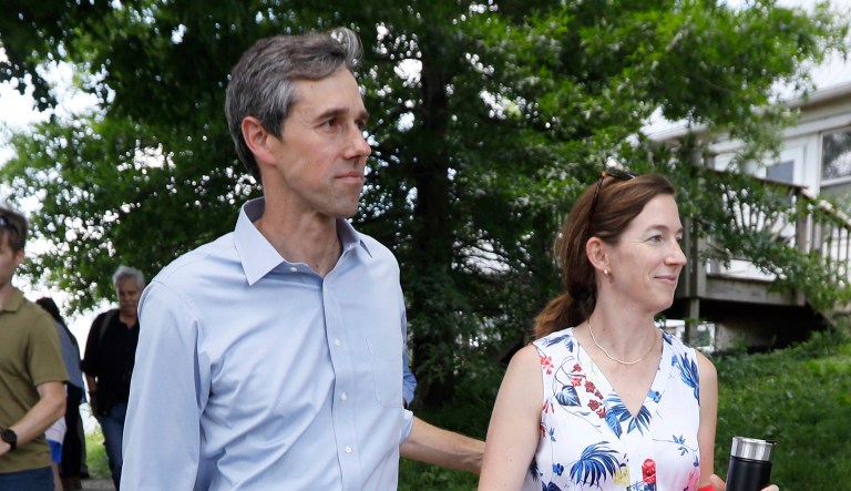 Democratic presidential candidate Beto O'Rourke walks with his wife Amy after touring the Coyote Run Farm, Friday, June 7, 2019, in Lacona, Iowa.