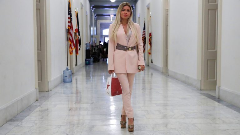Simona Mangiante Papadopoulos, wife of former Donald Trump campaign adviser George Papadopoulos, pauses as she walks down a hallway after attending a closed-door meeting with Democrats on the House intelligence committee, Wednesday, July 18, 2018, on Capitol Hill in Washington. George Papadopoulos pleaded guilty last year to lying to investigators about his contacts with people linked to Russia during the campaign. 