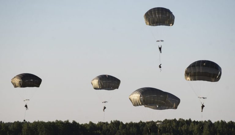 U.S. paratroopers from the 82nd Airborne Division from Fort Bragg in North Carolina, reach the ground after jumping from a US Air Force C-17 aircraft during a 'Saber Strike 2018' military exercises at the Gaiziunai Training Area, some 130 kms (80 miles) west of the capital Vilnius, Lithuania, Saturday, June 9, 2018. A major U.S.-led military exercise with 18,000 soldiers from 19 primarily NATO countries is taking place in the alliance's eastern flank involving Poland and the three Baltic states of Estonia, Latvia, Lithuania.