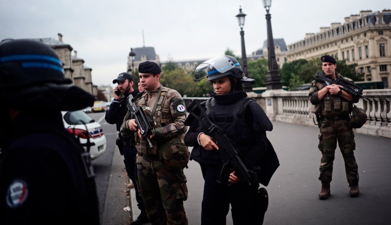 Armed police officers and soldiers patrol after an incident at the police headquarters after in Paris, Thursday, Oct. 3, 2019. A French police union official says an attacker armed with a knife has killed one officer inside Paris police headquarters before he was shot and killed. 