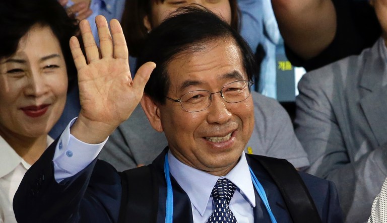 In this June 5, 2014 file photo, Park Won-soon, candidate for Seoul city mayor of the main opposition party New Politics Alliance for Democracy celebrates his victory in the Seoul mayoral election at his office in Seoul, South Korea. Police say on Thursday, July 9, 2020, the mayor of South Korean capital Seoul has been reported missing and search operations are underway.