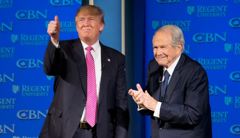 Republican presidential candidate Donald Trump, accompanied by Rev. Pat Robertson, gives a thumbs up to the crowd after speaking at Regent University in Virginia Beach, Va., Wednesday, Feb. 24, 2016.